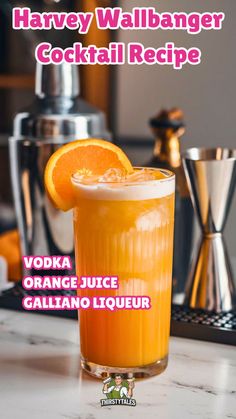 an orange juice cocktail in a tall glass on a counter with the words havey wallhanger cocktail recipe