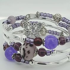 These handmade bracelets with lots of bangles that are easy to wear and simply wrapped around the wrist with no difficult-to-attach clasps. With beautiful, high quality materials, including glass beads, pewter spacers, and adorable charms, 3 Loop Memory Bracelet with a Butterfly and Heart Charm on each end. Stainless steel hypoallergenic memory wire to create a five loop, 3 loop or 1 loop bracelet which will easily adjust to the size of your wrist, and is accented with charms on each end. This a Metal Bracelets With Spacer Beads For Gift, Hand-strung Metal Bracelet For Gift, Hand-strung Metal Bracelet As Gift, Adjustable Bangle Charm Bracelet With Extender, Silver Beaded Wrap Bracelet For Friendship, Hand Wrapped Purple Bracelets, Adjustable Bracelets With Spacer Beads For Gift, Adjustable Metal Bracelets With Round Beads, Adjustable Metal Bracelet With Round Beads