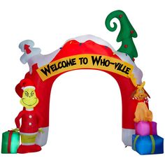 an inflatable welcome arch with santa clause and other holiday decorations on the front