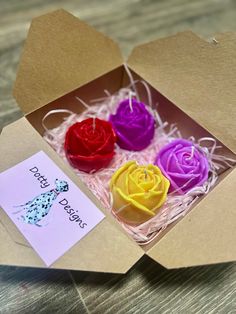 three different colored roses in a box with a note on the inside that says happy birthday