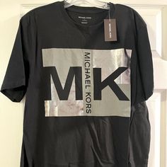 Nwt, Unisex Michael Kors T-Shirt, Black/Silver Metallic, Sz. L Michael Kors Mens, Silver Short Sleeve Graphic Tee, Michael Kors Cotton Crew Neck T-shirt, Michael Kors Black Crew Neck Top, Silver Graphic Tee With Crew Neck, Silver Graphic Tee With Short Sleeves, Silver Crew Neck Cotton T-shirt, Silver Cotton Crew Neck T-shirt, Silver Graphic Print Cotton Top