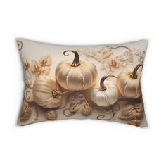 a decorative pillow with pumpkins and leaves on the front, along with pearls in the back