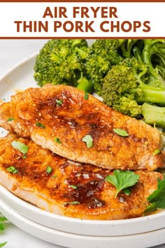 two pieces of chicken with sauce and broccoli on a white plate text reads air fryer thin pork chops