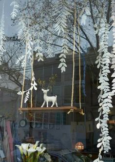 there is a fake deer in the window