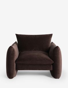 a brown chair sitting on top of a white floor