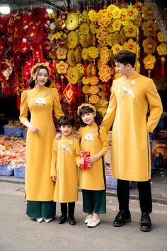 Family matching Traditional Vietnamese Ao Dai. Mom and daughters include ao dai and pants. Dad and boys only have Ao Dai. Very well made with high-quality Velvet fabric. Hand embroidery This set includes the Ao Dai and pants with no headband. It's Asian Size, it may run out 1-2 size smaller than international size.  Please see size chart for measurements of available pre-made sizes. Please provide your chest and waist measurement when placing your order so we can ensure the best fit for you. Ple Spring Long Sleeve Sets For Traditional Ceremonies, Festive Long Sleeve Dresses Matching Set, Festive Long Sleeve Ao Dai For Traditional Ceremonies, Ceremonial Embroidered Ao Dai With Long Sleeves, Traditional Long Sleeve Ao Dai For Festive Occasions, Traditional Festive Ao Dai With Stand Collar, Festive Long Sleeve Embroidered Cheongsam, Spring Festive Embroidered Ao Dai, Embroidered Long Sleeve Ao Dai For Festive Occasions