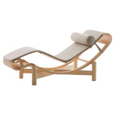 the chaise lounge chair is made out of wood and has a cushion on it