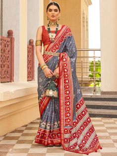 With its beautiful traditional look, the incredible grey patola printed silk festival wear saree with blouse is the perfect attire for weddings, festivals, and other special occasions. This stunning grey saree features patola printed work all over, adding a touch of elegance to your ensemble. The attached tassels on the pallu add a playful twist, making it a truly unique piece.
Made from high-quality silk material, this saree is not only comfortable to wear but also exudes a luxurious sheen that Saree Drapes, Patola Print, Red Silk Blouse, Silk Design, Grey Saree, Indian Sarees Online, Printed Saree, Wear Saree, Traditional Attire