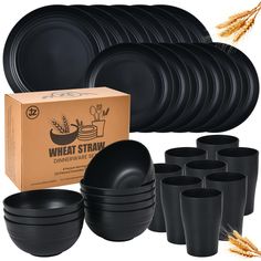 black dinnerware set with wheat stalks on the side and cardboard box in front of it