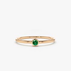 Item Details

Made to Order
Gold KT: 14k Solid Gold
Round Emerald: 2.5MM
 Number of Stones: 1
 Total CTW: 0.08ctw
 Width of Band: 1.20mm
 Setting Type: Bezel

 
 Description 
The dazzling solitaire emerald is set on a dainty solid gold ring band. Give your loved one a gift that’s perfect for her. Emerald Ring Simple Stone, Gold Ring Band, Solid Gold Band, Jewels Rings, Solid Gold Ring, Hot Jewelry, Local Jewelry, Gold Band Ring, Handcrafted Rings