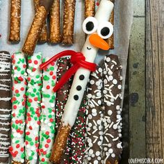 an assortment of pretzels and crackers in the shape of a snowman