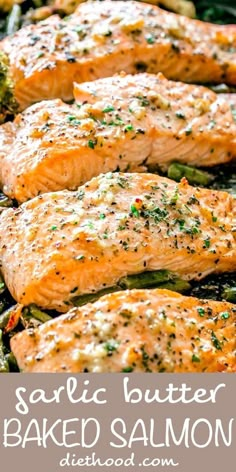 grilled salmon and asparagus on a sheet pan with garlic butter in the middle