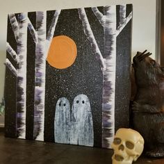 a painting with two white owls and a skull on the table in front of it