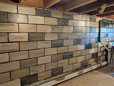 a room that has some kind of wall made out of blocks of wood and tile