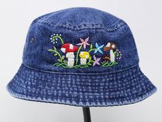 Item: mushroom embroidered bucket hat Material: 100% cotton Size: one size fits most for woman Embroidery: hand made with acrylic thread Free first class shipping, upgradable priority mail service. 30 days return policy, feel confident at your purchase! Adjustable Cotton Hat With Embroidered Patch, Summer Cotton Hat With Embroidered Patch, Custom Embroidered Cotton Summer Hats, Custom Embroidered Cotton Hats For Summer, Adjustable Cotton Mini Hats Casual Style, Adjustable Embroidered Cotton Hat, Custom Embroidered Summer Hats With Adjustable Fit, Cotton Hats With Custom Embroidery And Curved Brim, Embroidered Cotton Hat With Curved Brim