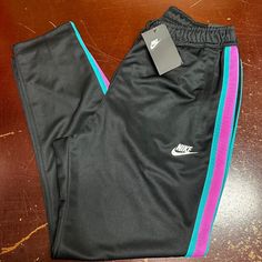 Nike Mens Black Elastic Waist Loose Fit Pockets Tapered Leg Track Pants Size L Brand: Nike Department: Men Size: L Color: Black Type: Pants Style: Track Pants Pattern: Solid Theme: Sports Occasion: Activewear Season: All Season Features: Pockets, Elastic Waist Condition: New With Tags I Offer Discounts For All Return Customers. - Jvs Nike Black Sweatpants For Streetwear, Black Tapered Sports Pants, Black Tapered Leg Sports Pants, Black Sports Pants With Side Pockets, Nike Black Joggers For Streetwear, Nike Black Pants For Streetwear, Nike Black Tapered Leg Pants, Nike Black Sweatpants With Elastic Waistband, Black Full-length Joggers With Pockets