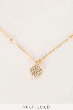 We love the dainty look of the Lulus Hidden Gem 14KT Gold Rhinestone Necklace! This cute necklace boasts a tiny 14KT gold plated chain, trimmed with tiny gold beads, that holds a round, clear cubic zirconia rhinestone-encrusted charm. Dress up any look easily with this stunning piece! Lobster clasp closure. 15" long with 3" extender chain. 14KT gold plated brass chain and cubic zirconia. Imported. Lulus | Hidden Gem 14KT Gold Rhinestone Necklace. Dainty Gold Rhinestone Necklace With Adjustable Chain, Dainty Gold Rhinestone Necklace With Delicate Chain, Rhinestones Clothes, Charm Dress, Staple Necklace, Cz Necklace, Gold Rhinestone, Cute Necklace, Necklace Dainty