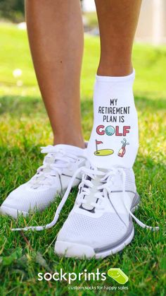 someone wearing white shoes with the words retirement plan is golf printed on them