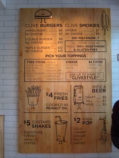 a wooden sign with instructions on how to order food