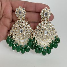 Green Kundan Chaandbali Earrings/Indian Earrings/pearl Earring/Pakistani Earrings/Statement Earrings/Long chandelier/Indian wedding Style 1 Height = 87 mm || Width = 57 mm Style 2 Height = 90 mm || Width = 55 mm Style 3 Height = 80 mm || Width = 50 mm Style 4 Height = 85 mm || Width = 62 mm Style 5 Height = 76 mm || Width = 55 mm Style 6 Length 66 mm Width 32 mm Style 7 Length 96 mm Width 51 mm Style 8 Height = 92 mm || Width = 67 mm  Style 9 Height = 100 mm || Width = 52 mm Style 10 Height = 73 Green Kundan Chandelier Earrings For Wedding, Green Chandbali Chandelier Earrings For Wedding, Green Chandelier Earrings For Wedding And Diwali, Green Chandelier Earrings For Wedding, Green Chandelier Earrings For Wedding And Festivals, Heavy Green Chandbali Chandelier Earrings, Green Chandbali Chandelier Earrings, Heavy Green Chandelier Earrings For Diwali, Traditional Green Pearl Earrings For Party