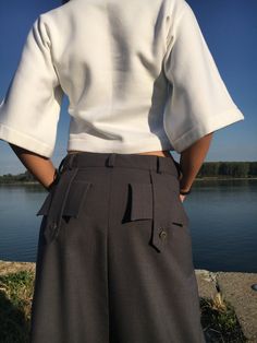 "Wool Harem Pants, Drop Crotch Pants, Avant Garde Clothing Available in black from cold wool. ◈ Stylish and chic fashion is our shared dream! You can be sure that this piece is made with a lot of love and craftsmanship. ◈ The white top is available here - https://etsy.me/2sJBMip ◈ S I Z I N G ◈ This item is available from XS to 4XL. Please, have a look at my Size Chart below before placing your order. ◈ D E L I V E R Y ◈ This item will be shipped in up to 5 days after your order was placed. We u Fitted High-waisted Wide Leg Pants With Cargo Pockets, Elegant High-waisted Cargo Pants, Fitted Wide Leg Trousers With Cargo Pockets, Fitted Wide-leg Bottoms With Cargo Pockets, Fitted Wide-leg Pants With Cargo Pockets, Fitted Harem Pants With Pockets For Work, Fitted Ankle-length Pants With Cargo Pockets, Fitted Wide Leg Shorts With Belt Loops, Fitted Wide Leg Harem Pants With Belt Loops