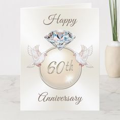 an anniversary card with a diamond on top