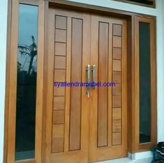 a pair of wooden doors sitting next to each other