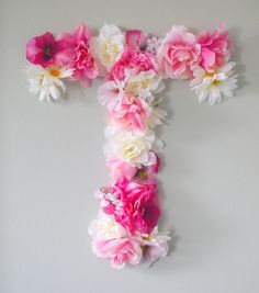 the letter f is made up of pink and white flowers