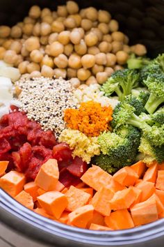 broccoli, carrots, chickpeas and other ingredients in a slow cooker