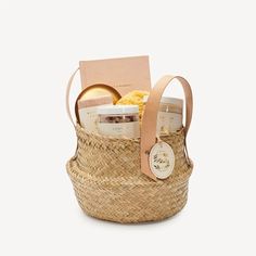 a basket filled with lots of different types of food in it's handles and tags