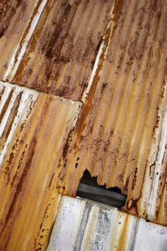 rusted corrugated roof with an opening in the middle