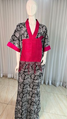 This Adire Ankara Silk Kaftan maxi dress is made with Polysilk. It can be styled in different ways, you can dress it up with high heels or dress down with flats/sneakers. The Hand can be worn in 2 ways. one ways shows off the arm, the 2nd way has the arm covered for modesty. Notice the slits.Other prints are also available, kindly start a conversation to ask for more information and pics.Contact us for custom looks and more style options. Sizing 🌺 Your height or desired kaftan length is needed. Fitted Long Pink Kaftan, Spring V-neck Kaftan With Batik Print, Pink Floor-length Kaftan For Spring, Silk Midi Dress With Kimono Sleeves, Pink Floor-length Spring Kaftan, Spring Batik Print Maxi Length Kaftan, Long Batik Print Dress For Spring, Spring Batik Print Maxi-length Kaftan, Long Batik Print Spring Dress