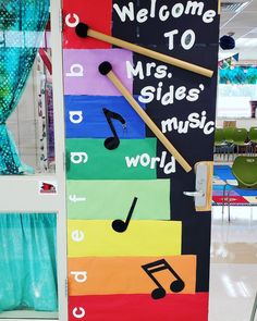 a classroom door decorated with musical instruments and welcome to mrs sides'music world sign