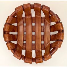 a wooden object with many pieces of wood in it's center and sides, on a white background