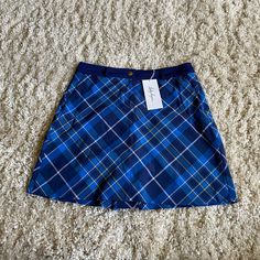 New With Tags Lady Hagen Skirt With Built In Shorts. Shorts Inside Are A Stretchy Material And Navy Blue. Outside Skirt Is Slightly Stretchy Material, Royal Blue, Gold, Navy, White Plaid. Waist Band Is Not Stretchy, Has A Few Folding Marks From The Hanger Due To The Type Of Material. Zipper And Button Closure, Pockets On Front. Gusset And Pockets On Back. Hydrodri Fabric. Women’s Size 6. Wave Aesthetic, French New Wave, Outfit References, Plaid Skirt, Plaid Skirts, White Plaid, New Wave, Waist Band, Navy White