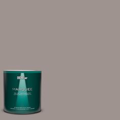 a can of marquee paint on a green background