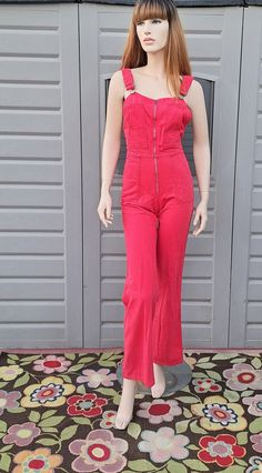 Cute pair of Vintage 70's  cotton jumpsuit overalls.   They have been dyed red and look adorable.      They have adjustable shoulder straps and  a metal Talon zipper up the front.  Some light frayiing on end edges of leg openings.  Great find! Measurements are taken with item laying flat so widths across must be doubled  Length = 52   in   in (measured without the straps, from the top of waist down to leg hems) across the chest= 16 in Across the Waist = 13  in Across the Hips =  17.5   in Across Retro Medium Wash Bib Front Overalls, Vintage Cotton Jumpsuit With Bib Front, Pink Jumpsuit 70s, 80’s Jumpsuit, Jumpsuit Overalls, Vintage Cotton Bib Front Jumpsuit/romper, Womens Overalls, Cotton Jumpsuit, 90s Aesthetic