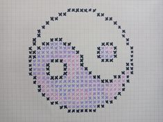 a cross stitch pattern with an odd looking face