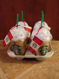 starbucks coffees wrapped in plastic wrap and sitting on a tray