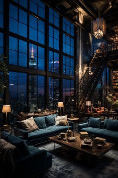 a living room filled with lots of furniture and tall windows overlooking the city at night