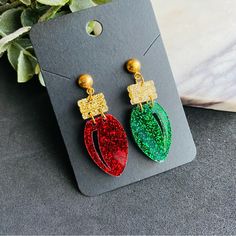 These Festive Red And Green Christmas Light Earrings Are Crafted From Glitter Acrylic, Giving Them A Fun, Sparkly Finish Perfect For The Holiday Season. Each Earring Resembles A Classic Christmas Light Bulb, With One In Red And The Other In Green For A Playful, Mismatched Design. The Acrylic Catches The Light, Adding A Cheerful Sparkle To Your Look. They Are Securely Attached To Stainless Steel Studs, Making Them Hypoallergenic And Durable For Comfortable, Long-Lasting Wear. These Earrings Are A Acrylic Christmas Earrings, Christmas Light Earrings, Green Christmas Lights, Red Light Bulbs, Red And Green Christmas, Whimsical Accessories, Laser Projects, Christmas Light Bulbs, Valentines Earrings