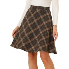 This skirt is timeless thanks to the plaid prints and easy a-line silhouette. Add plaid patterns to your transitional wardrobe with the skirt. It is made to sit high on the waist with an elasticated waistband for a flattering silhouette. Team yours with a chunky knit jumper and Chelsea boots for a versatile work-to-weekend style. You can pair this skirt with boots and overcoats for a warmer outfit. Plaid Overall Dress, Plaid Bodycon Dress, Chunky Knit Jumper, Midi Flare Skirt, Black Pleated Skirt, Skirts With Boots, Weekend Style, Vintage Plaid, Plaid Skirt