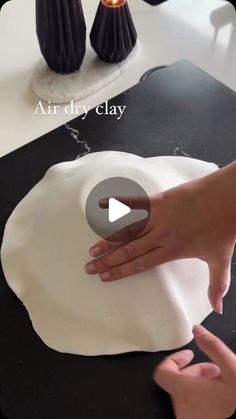 someone is making an art project with clay