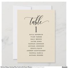 a table number card with the word table 1 in cursive writing on it