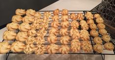 there are many small pastries on the rack