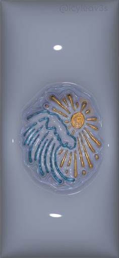 an artistic glass plate with gold and blue designs on the bottom, in front of a gray background