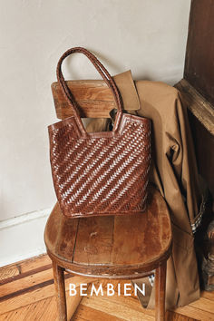 For sipping cappuccinos and reading Proust, the Camilla is a day bag with a twist. A touch smaller than your typical work bag with a notched "V" that makes this functional tote an outfit maker. Bembien Bags, Outfit Maker, Work Bag, Day Bag, Braided Leather, Hand Weaving, Twist, Reading, Leather