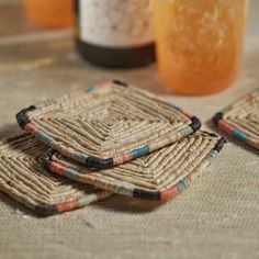 three woven coasters sitting on top of a table