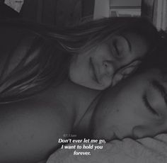 a man and woman laying next to each other on a bed with the caption don't ever let me go, i want to hold you forever