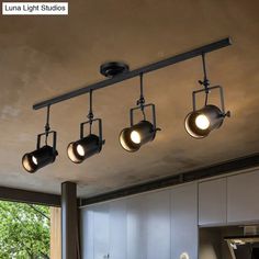 an overhead track light fixture in a kitchen